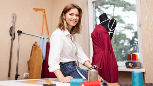 Woman fashion brand entrepreneur in her atelier, building her clothing brand